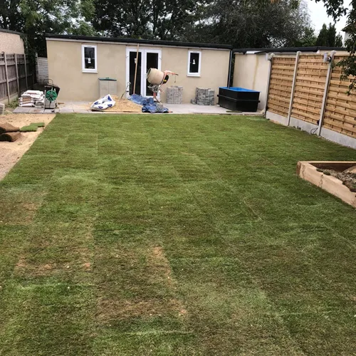 bungalow at the bottom of a garden